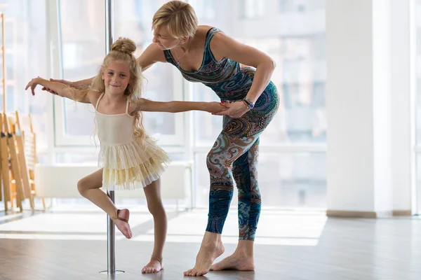 Beautiful little dancer and her dancing teacher
