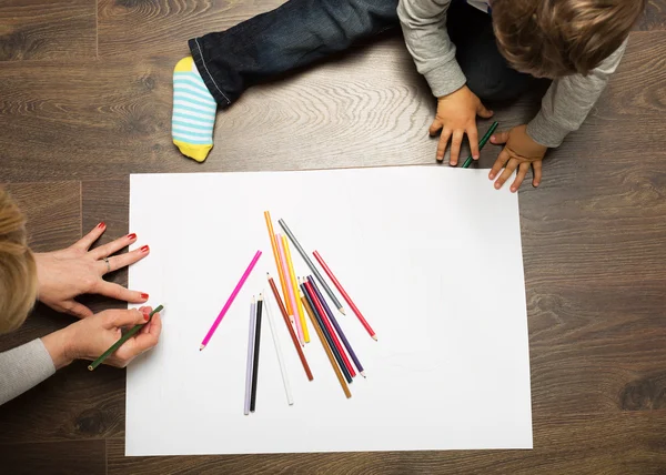Toddler drawing on the floor