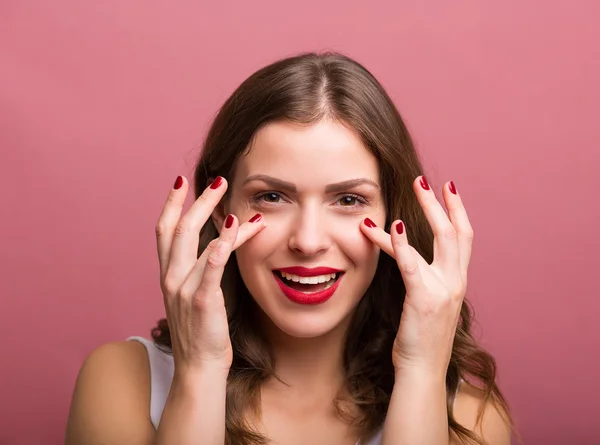 Woman applying an eye cream