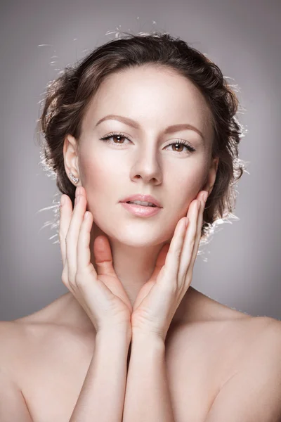 Portrait of beautiful young woman with clean face