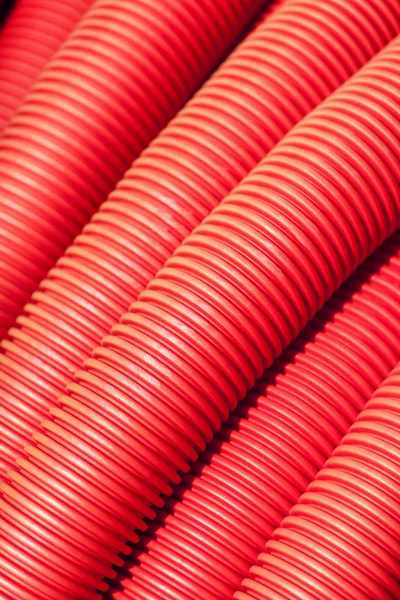 Tubing. Red plumbing pipe close-up.