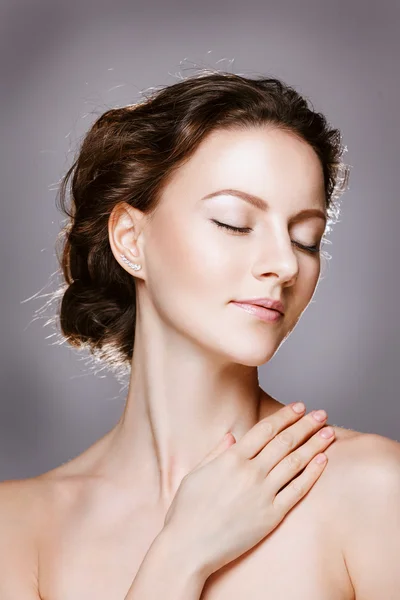 Portrait of beautiful young woman with clean face