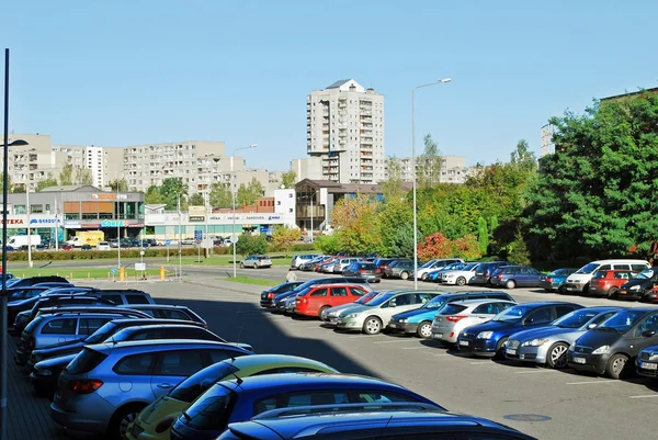 Pasilaiciai district street with cars and houses