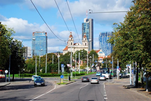 Vilnius city center street with cars and houses