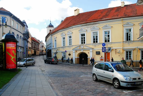 Vilnius city center street with cars and houses