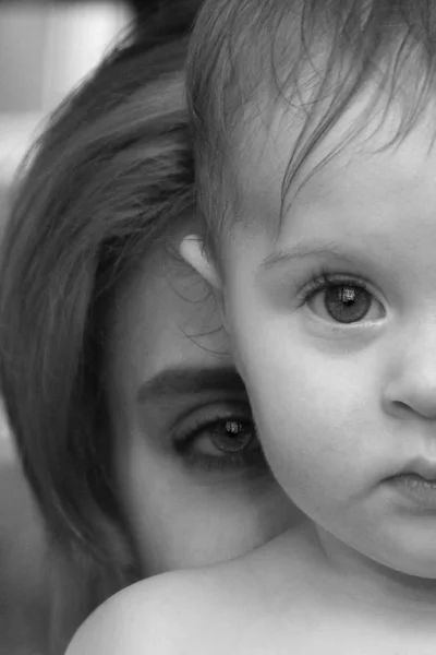 Yerevan, Armenia - June 25, 2008: black and white touching portrait of a mother with a child, close up