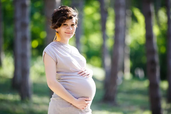 Pregnant women in park