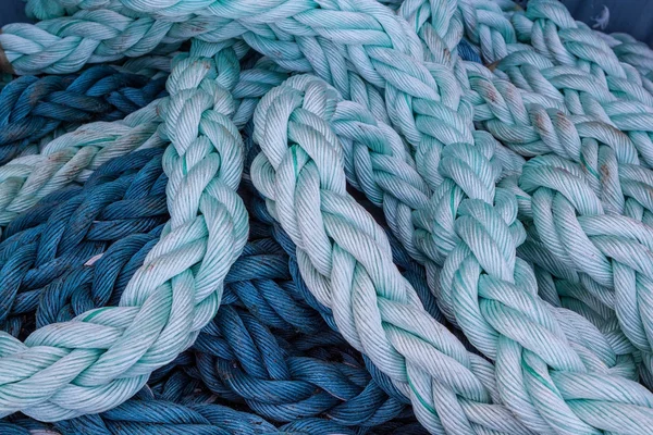 Close-up of an old frayed boat rope .
