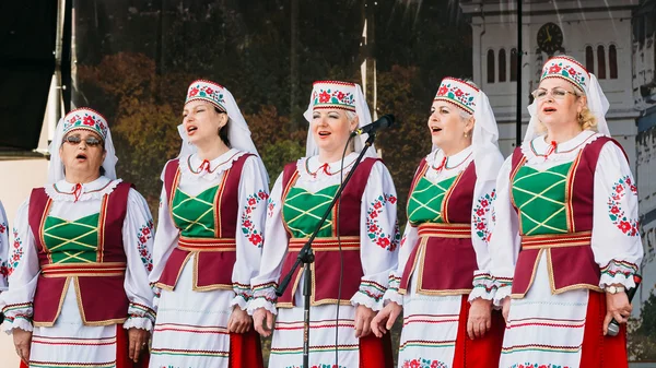 Unknown women group in national clothes perform folk songs in Go