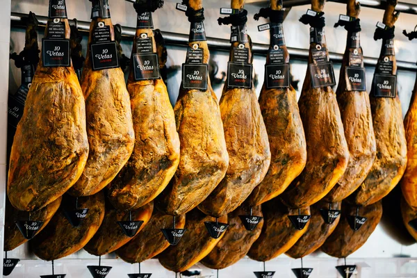 Hanging Jamon meat in shop. Spanish ham.