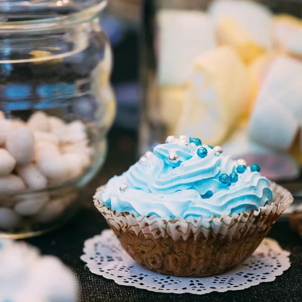 Dessert Sweet Tasty cupcake in Candy Bar On Table