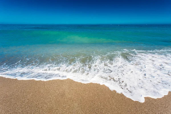 Soft Sea Ocean Waves Wash Over Golden Sand Background. Sand beac
