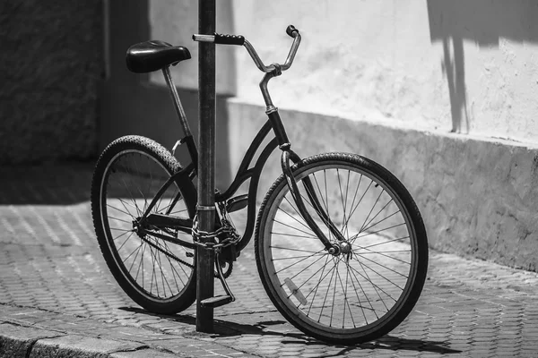 Black Bicycle Parking On Street In European City. Black And Whit