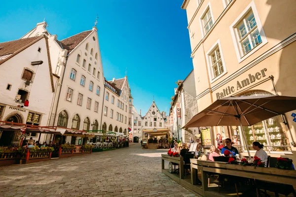 People resting In Street Cafe In Old Town Of Tallinn, Estonia