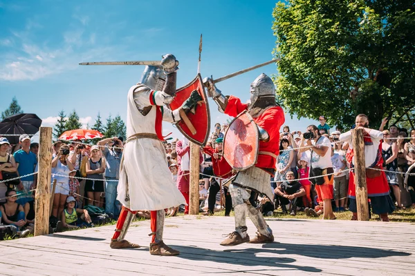 Knights In Fight With Swords. Restoration Of Knightly Battle