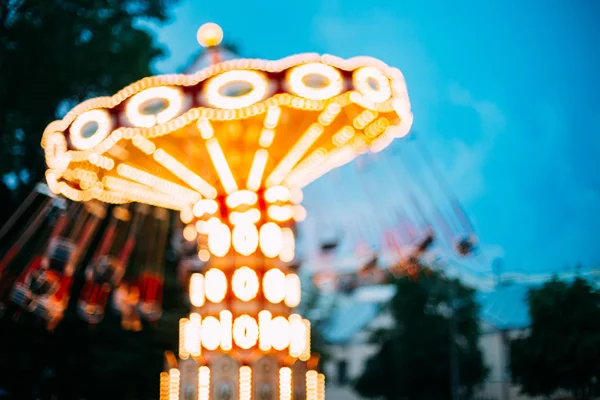 Abstract Motion Blur Image Of Illuminated Carousel Amusement Park