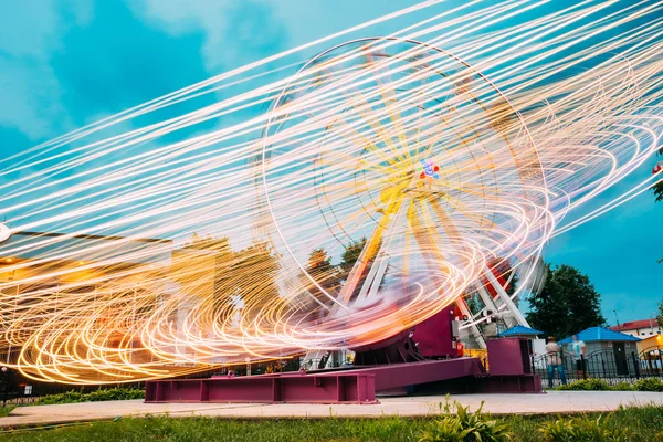 Motion Blurred Of High Speed Rotating Attraction Amusement Park.
