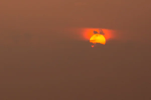 Close View Of Yellow Sun Disk With Red Glow Around, Partly Cover