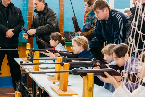 Unrecognizable Belarusian secondary school pupils girls shooting