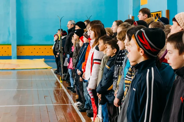 Unrecognizable Belarusian secondary school pupils lined up in th