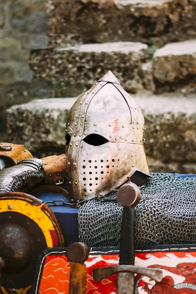 Protective helmet with a visor on medieval knight