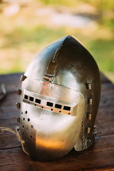 Knight Helmet Of Medieval Suit Of Armour On Table