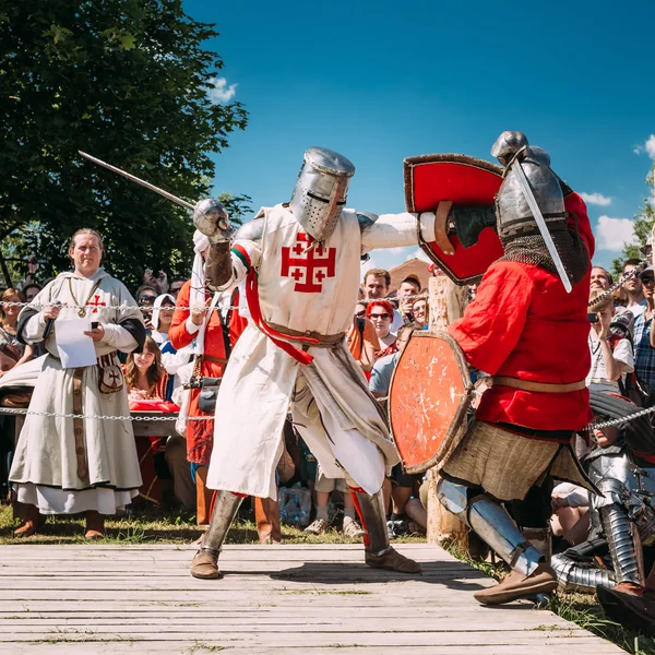 Knights In Fight With Sword. Restoration Of Knightly Battle