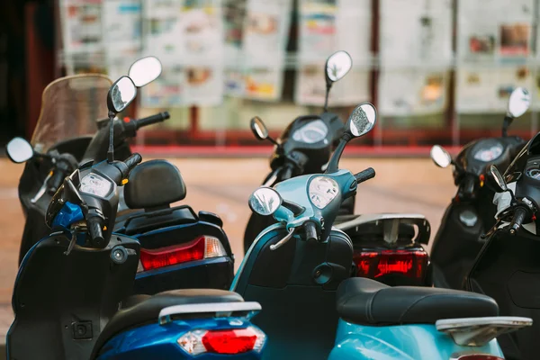 Motorbike, motorcycle scooters parked in city