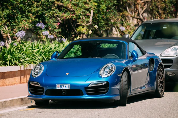 Blue color Porsche 911 Turbo S 2014 on street of Monte Carlo, Monaco