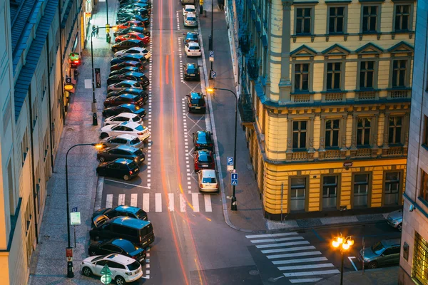 Night Traffic and parked cars on the Hybernska street in Prague,