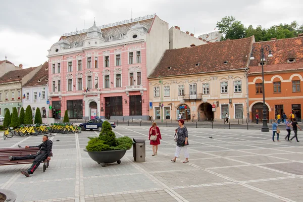 The renovated market square. Flock of Tourists walking on the main square of the city