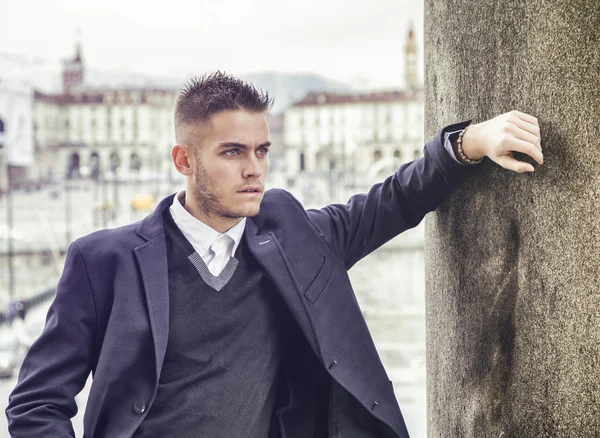 Handsome young man outdoor in jacket and shirt