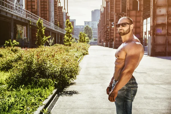 Handsome Muscular Shirtless Hunk Man Outdoor in City Setting