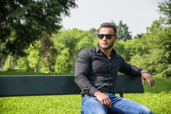Handsome Muscular Hunk Man Outdoor in City Park