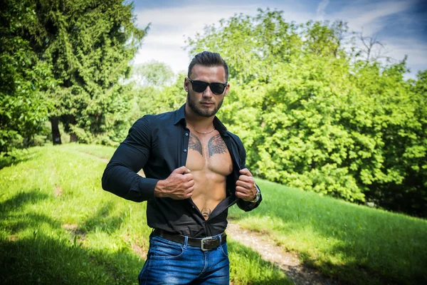 Handsome Muscular Hunk Man Outdoor in City Park