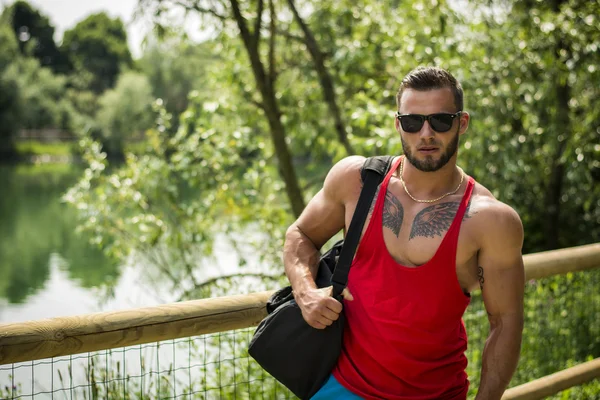 Handsome Muscular Hunk Man Outdoor in City Park