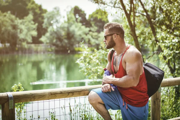 Handsome Muscular Hunk Man Outdoor in City Park