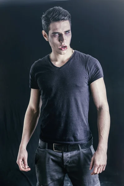 Portrait of a Young Vampire Man with Black T-Shirt