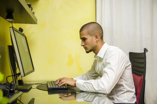 Young Man with Doing Homework at Computer Desk
