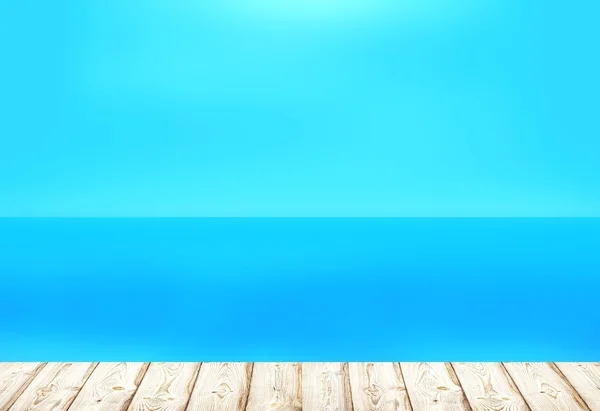 Light wooden planks of the pier or boardwalk at the waterfront. Warm calm blue sea. Tropical calm and cloudless sky background.