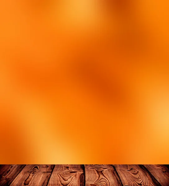 Orange fiery blur background. Vivid wood planks. Rustic texture. Autumn matte background.