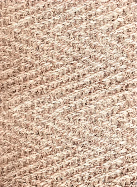 Light rigid weaving of natural fibers texture. Knitting or mat.