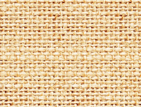 Light rigid weaving of natural fibers texture. Knitting, canvas or burlap background.