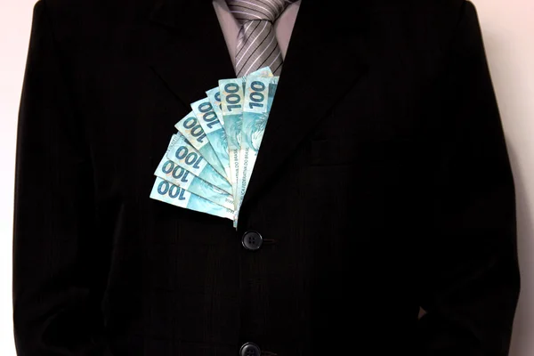 Man with money bills in suit