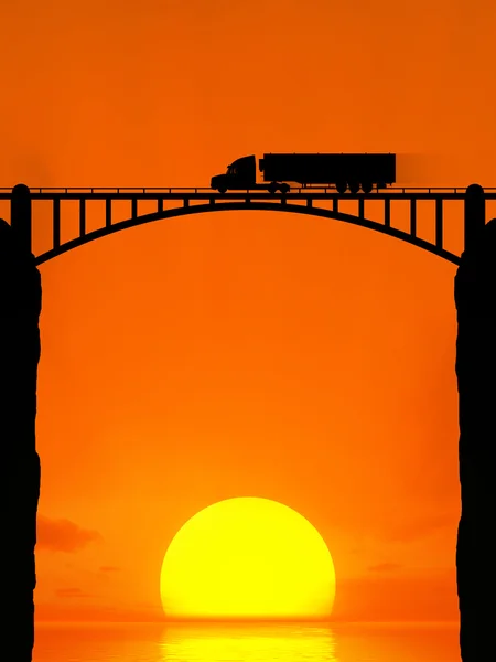 Silhouette of a moving truck on the bridge.