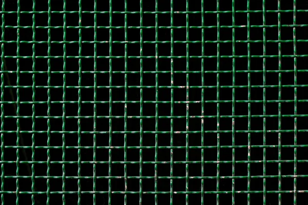 Green metal grid background