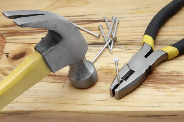 Hammer, nails and plier