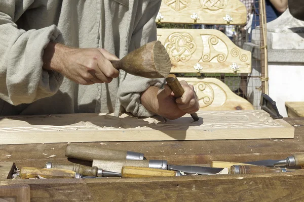 Hands of wood sculptor