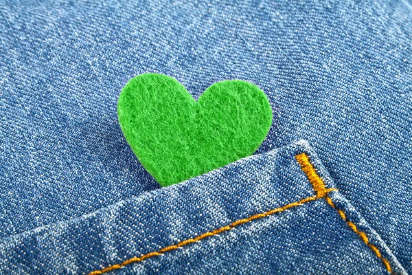 Green heart in jeans pocket
