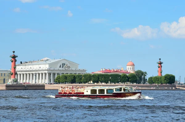 ST. PETERSBURG, RUSSIA, JULY, 20, 2014. Russian scene: tourists with pleasure boat looking for the strelka of Vasilievsky island in sunny day